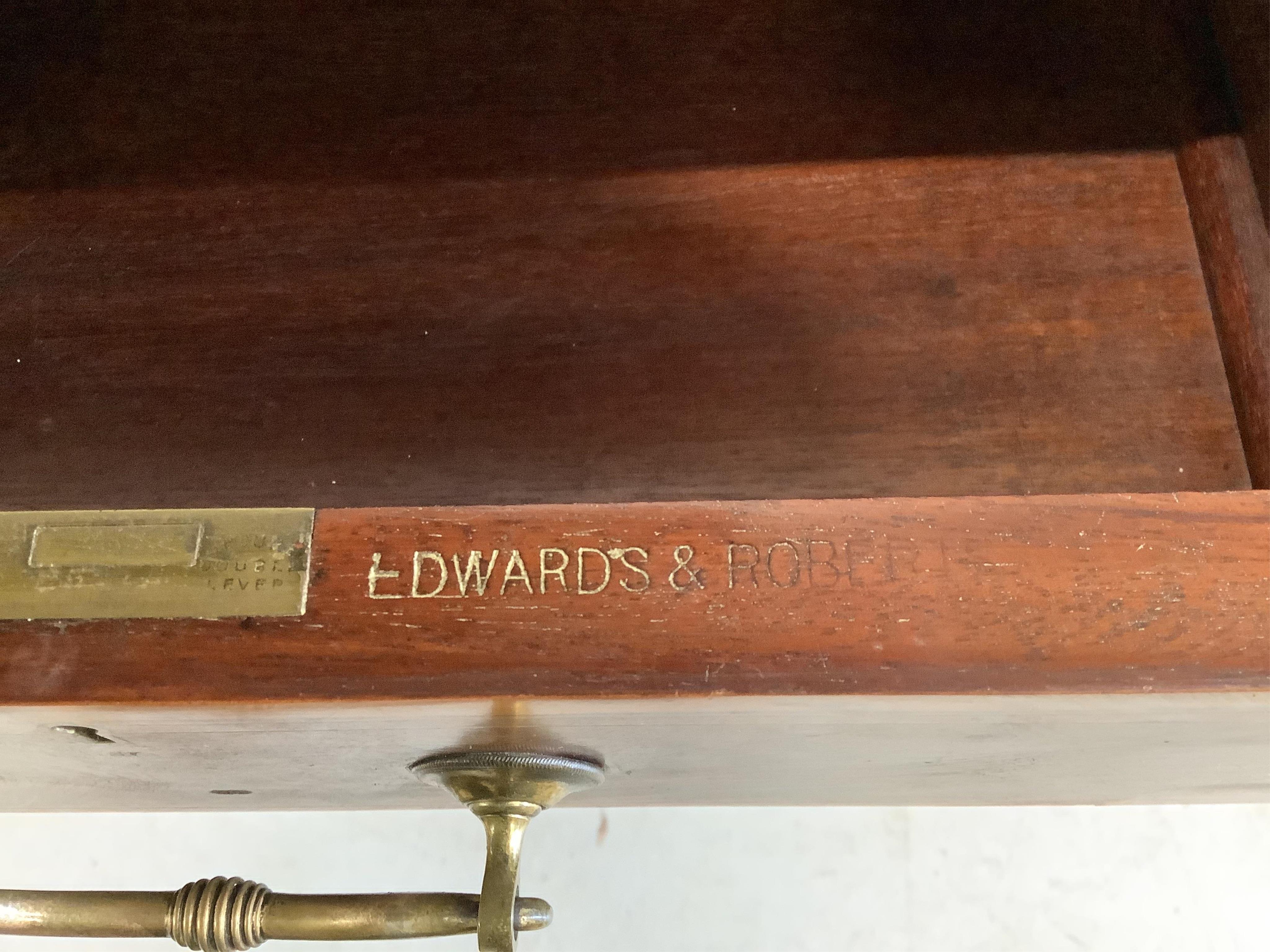 An Edwardian Edwards and Roberts satinwood banded mahogany writing table, width 91cm, depth 47cm, height 72cm. Condition - fair, lacks leather top